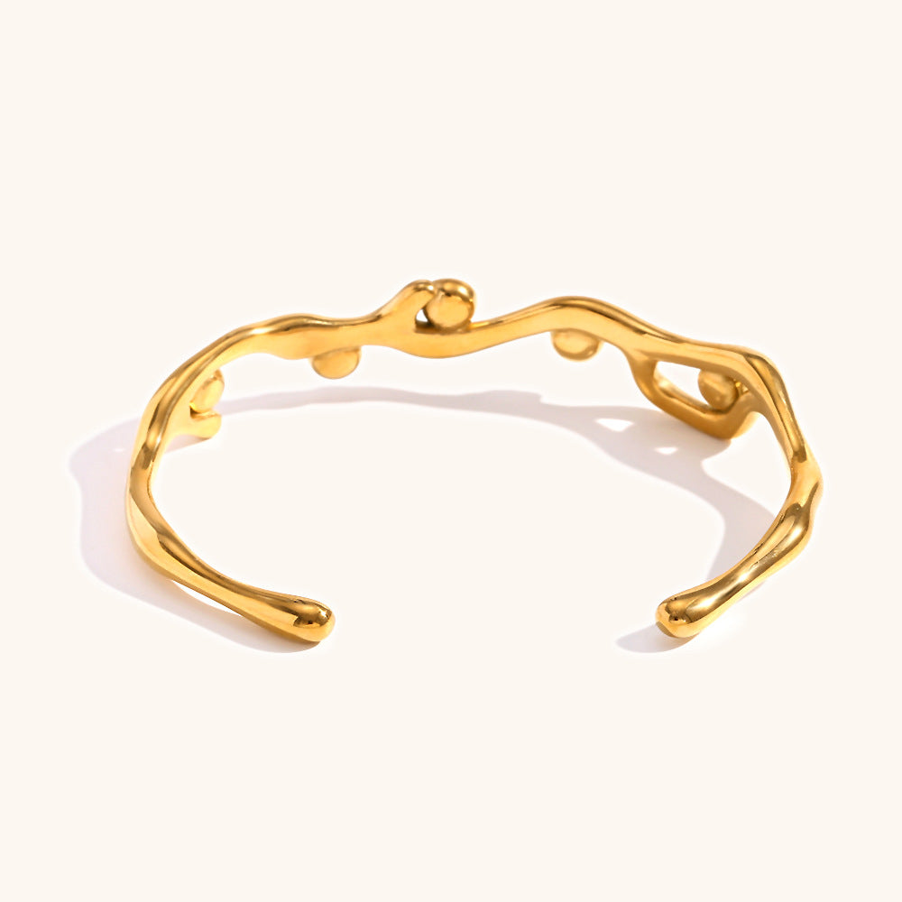 Colored diamond bracelet with stainless steel branches plated with 18K gold.