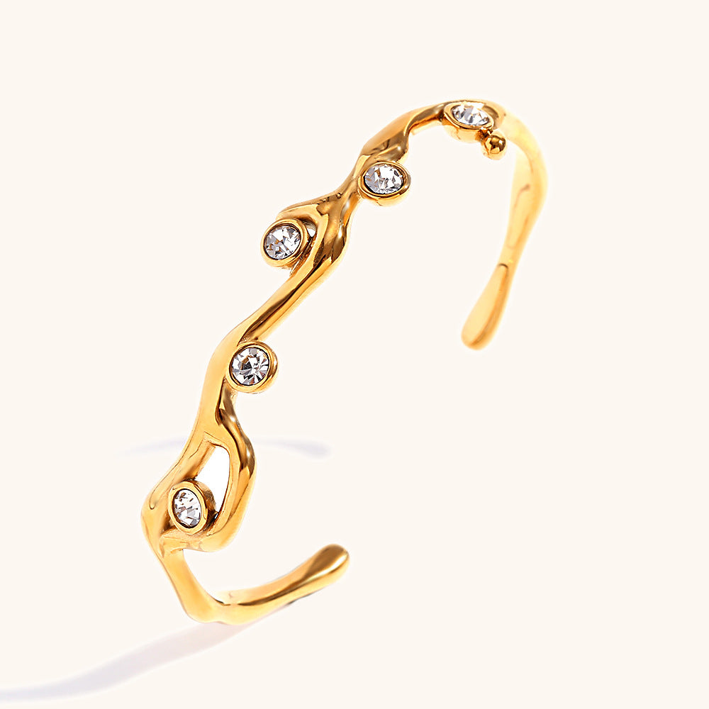 Colored diamond bracelet with stainless steel branches plated with 18K gold.